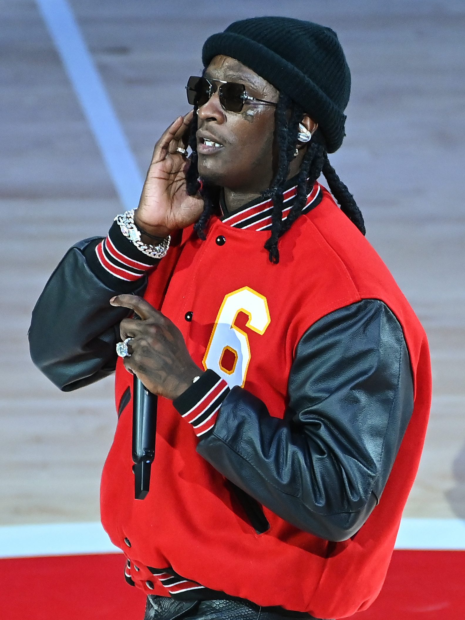 ATLANTA, GEORGIA - NOVEMBER 17:  Rapper Young Thug performs at halftime during the Boston Celtics v Atlanta Hawks game at State Farm Arena on November 17, 2021 in Atlanta, Georgia. (Photo by Paras Griffin/Getty Images)