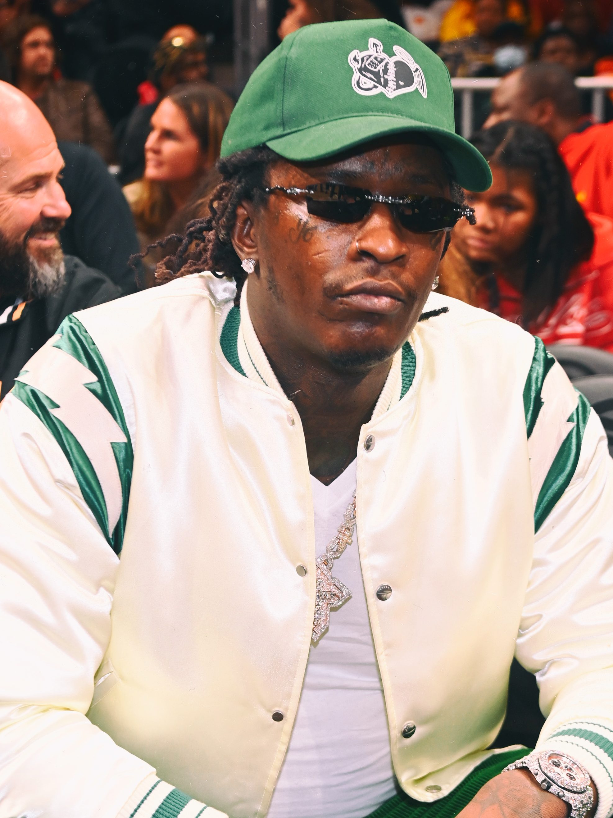 ATLANTA, GEORGIA - MARCH 25:  (EDITORS NOTE: Image has been processed using digital filters.) Rapper Young Thug attends the game between Golden State Warriors and the Atlanta Hawks at State Farm Arena on March 25, 2022 in Atlanta, Georgia. (Photo by Paras Griffin/Getty Images)