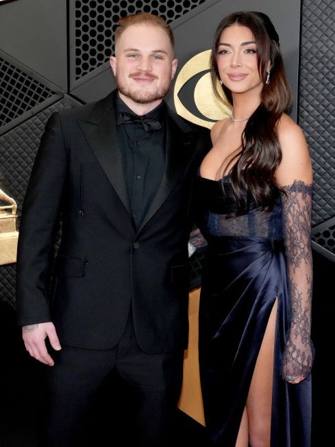 LOS ANGELES, CALIFORNIA - FEBRUARY 04: (FOR EDITORIAL USE ONLY) (L-R) Zach Bryan and Bri LaPaglia attend the 66th GRAMMY Awards at Crypto.com Arena on February 04, 2024 in Los Angeles, California. (Photo by Jeff Kravitz/FilmMagic)