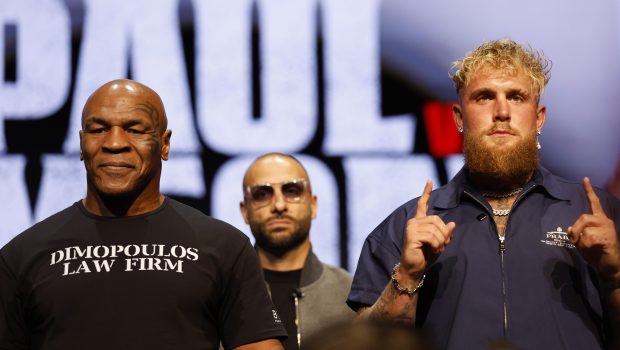 NEW YORK, NEW YORK - MAY 13: (L-R) Mike Tyson and Jake Paul speak onstage at the press conference in promotion for the upcoming Jake Paul vs. Mike Tyson boxing match at The Apollo Theater on May 13, 2024 in New York City. (Photo by Sarah Stier/Getty Images for Netflix)