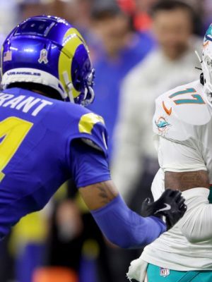 INGLEWOOD, CALIFORNIA - NOVEMBER 11: Jaylen Waddle #17 of the Miami Dolphins runs with ball against Cobie Durant #14 of the Los Angeles Rams during the first quarter in the game at SoFi Stadium on November 11, 2024 in Inglewood, California. (Photo by Sean M. Haffey/Getty Images)