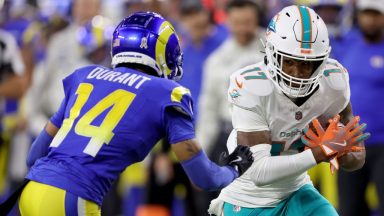 INGLEWOOD, CALIFORNIA - NOVEMBER 11: Jaylen Waddle #17 of the Miami Dolphins runs with ball against Cobie Durant #14 of the Los Angeles Rams during the first quarter in the game at SoFi Stadium on November 11, 2024 in Inglewood, California. (Photo by Sean M. Haffey/Getty Images)