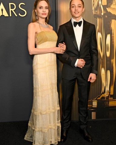 HOLLYWOOD, CALIFORNIA - NOVEMBER 17: (L-R) Angelina Jolie and Knox Jolie-Pitt attend the 2024 Governors Awards at Dolby Theatre on November 17, 2024 in Hollywood, California.  (Photo by Jon Kopaloff/Getty Images)