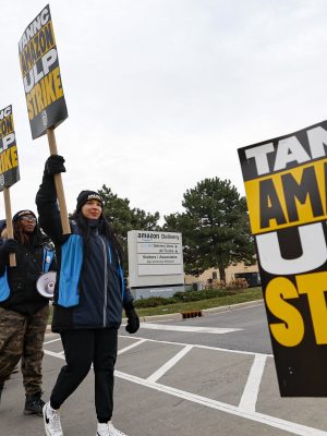 Amazon delivery drivers walk the picket line outside Amazon delivery station as they went on strike in Skokie, Illinois on December 19 2024. Thousands of workers at Amazon facilities across the United States went on strike Thursday, the Teamsters Union said, halting work at the height of the busy holiday gift-giving season. (Photo by KAMIL KRZACZYNSKI / AFP)