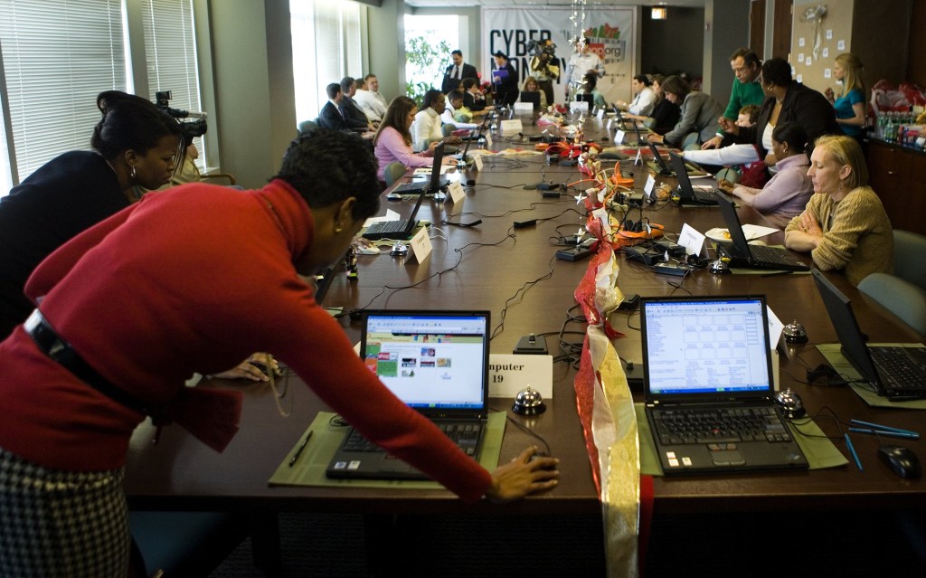 WASHINGTON - NOVEMBER 27: Consumers shop online during a shop and lunch event in the boardroom of the National Retail Federation November 27, 2006 in Washington, DC. The National Retail Federation, a retail trade group, provided laptop computers, personal shoppers and lunch to encourage shoppers who stopped by to participate in Cyber Monday, the online retail world's equivalent of Black Friday. (Photo by Brendan Smialowski/Getty Images)