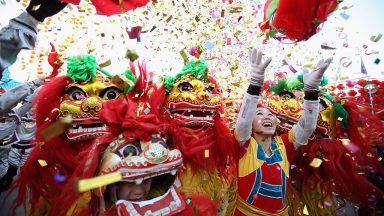 BEIJING, CHINA - JANUARY 22:   Chinese folk artists perform the lion dance at a temple fair to celebrate the Lunar New Year of Dragon on January 22, 2012 in Beijing, China. Falling on January 23 this year, the Chinese Lunar New Year, also known as the Spring Festival, which is based on the Lunisolar Chinese calendar, is celebrated from the first day of the first month of the lunar year and ends with Lantern Festival on the Fifteenth day.  (Photo by Feng Li/Getty Images)