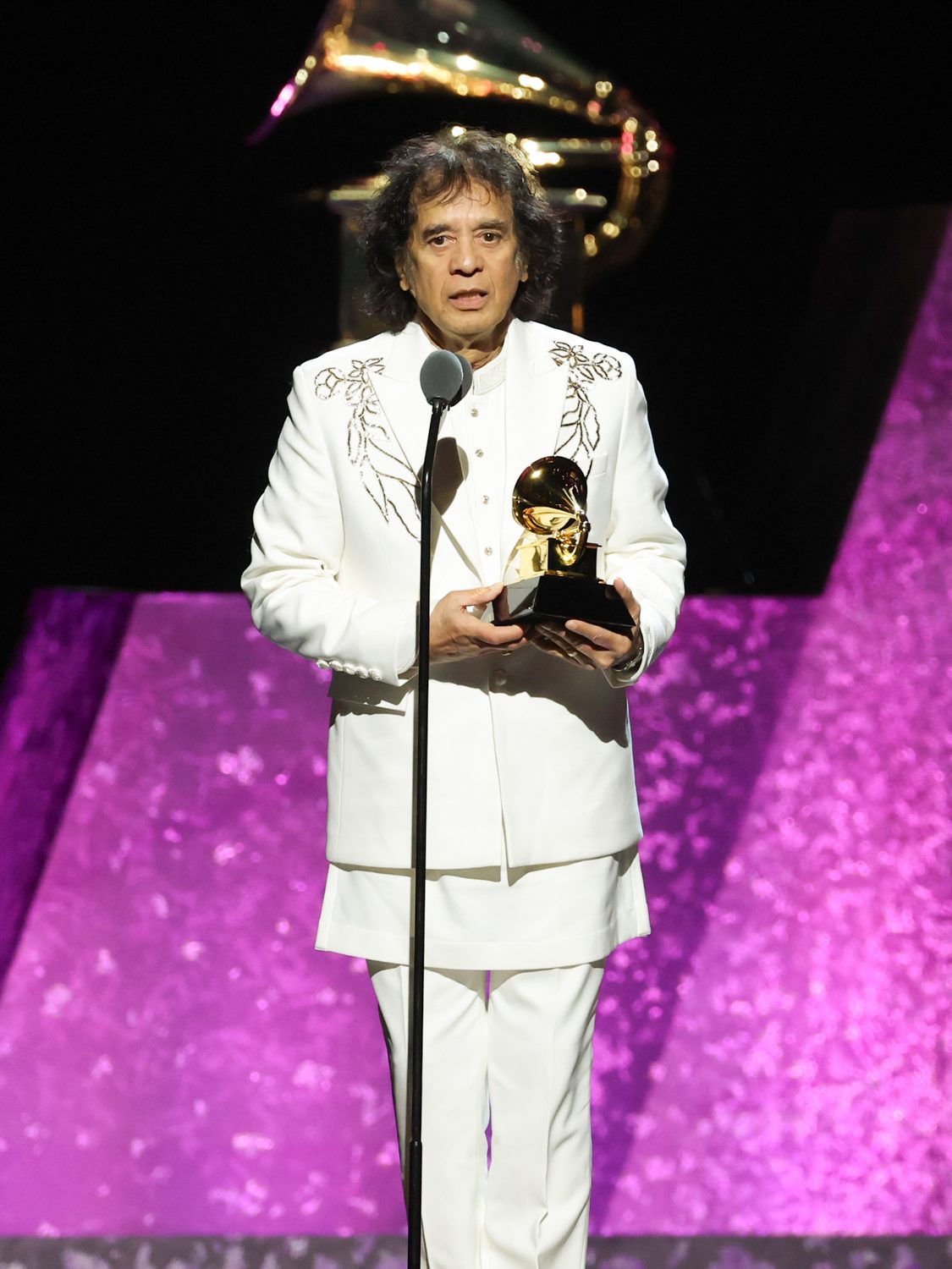 Zakir Hussain, Edgar Meyer and Rakesh Chaurasia accept the "Global Music Performance" award for "Pashto" at the 66th Annual GRAMMY Awards Premiere Ceremony held at Peacock Theater on February 4, 2024 in Los Angeles, California. (Photo by Rich Polk/Billboard via Getty Images)
