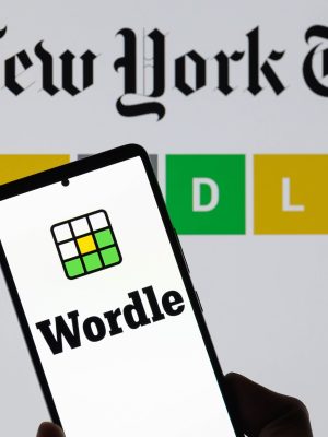 The Wordle logo is being displayed on a smartphone with The New York Times visible in the background in this photo illustration in Brussels, Belgium, on June 1, 2024. (Photo by Jonathan Raa/NurPhoto)