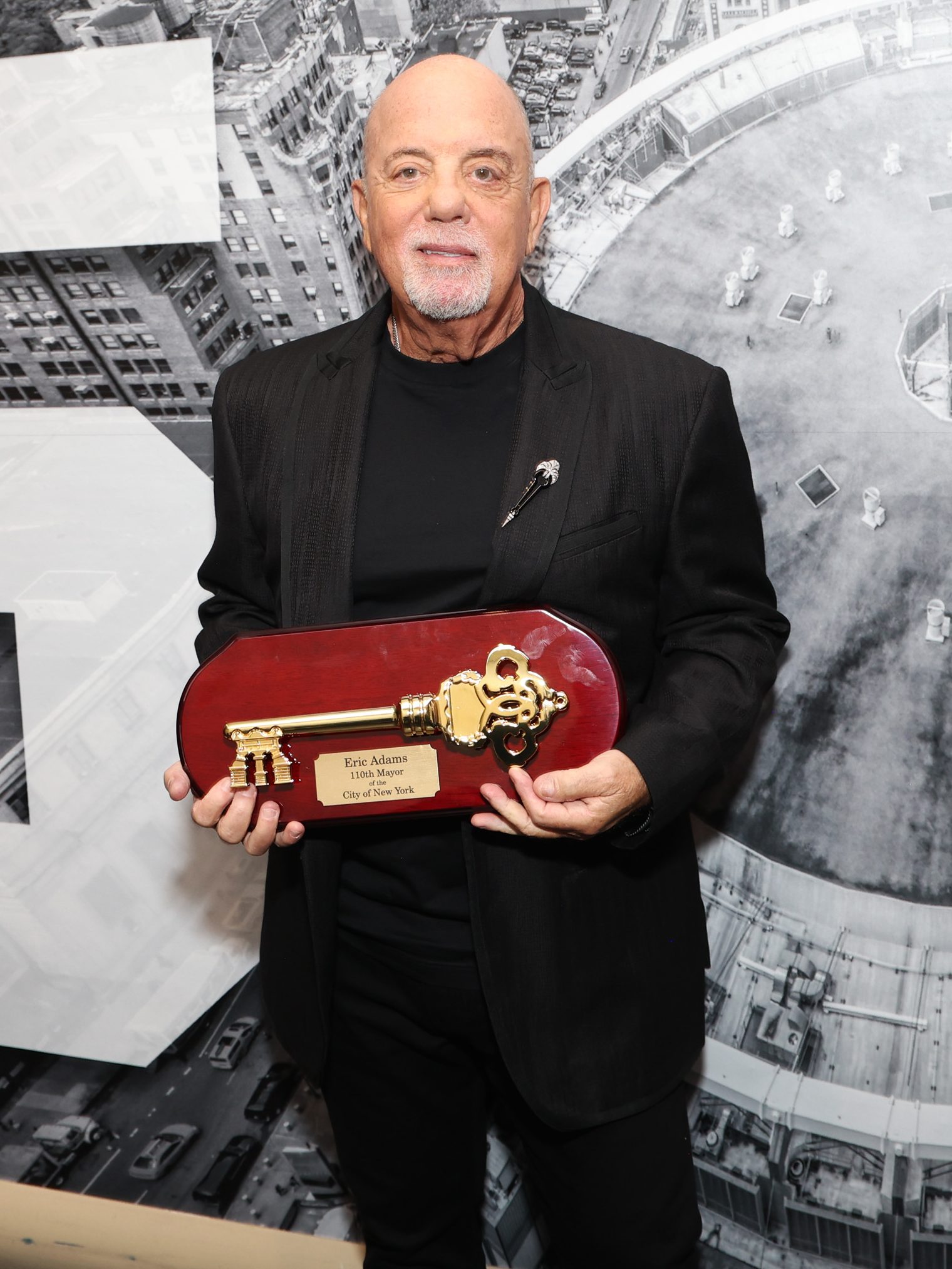 NEW YORK, NEW YORK - JULY 25:  Billy Joel is presented with the Key to the City of New York backstage before the last show of his residency at Madison Square Garden on July 25, 2024 in New York City. (Photo by Kevin Mazur/Getty Images)