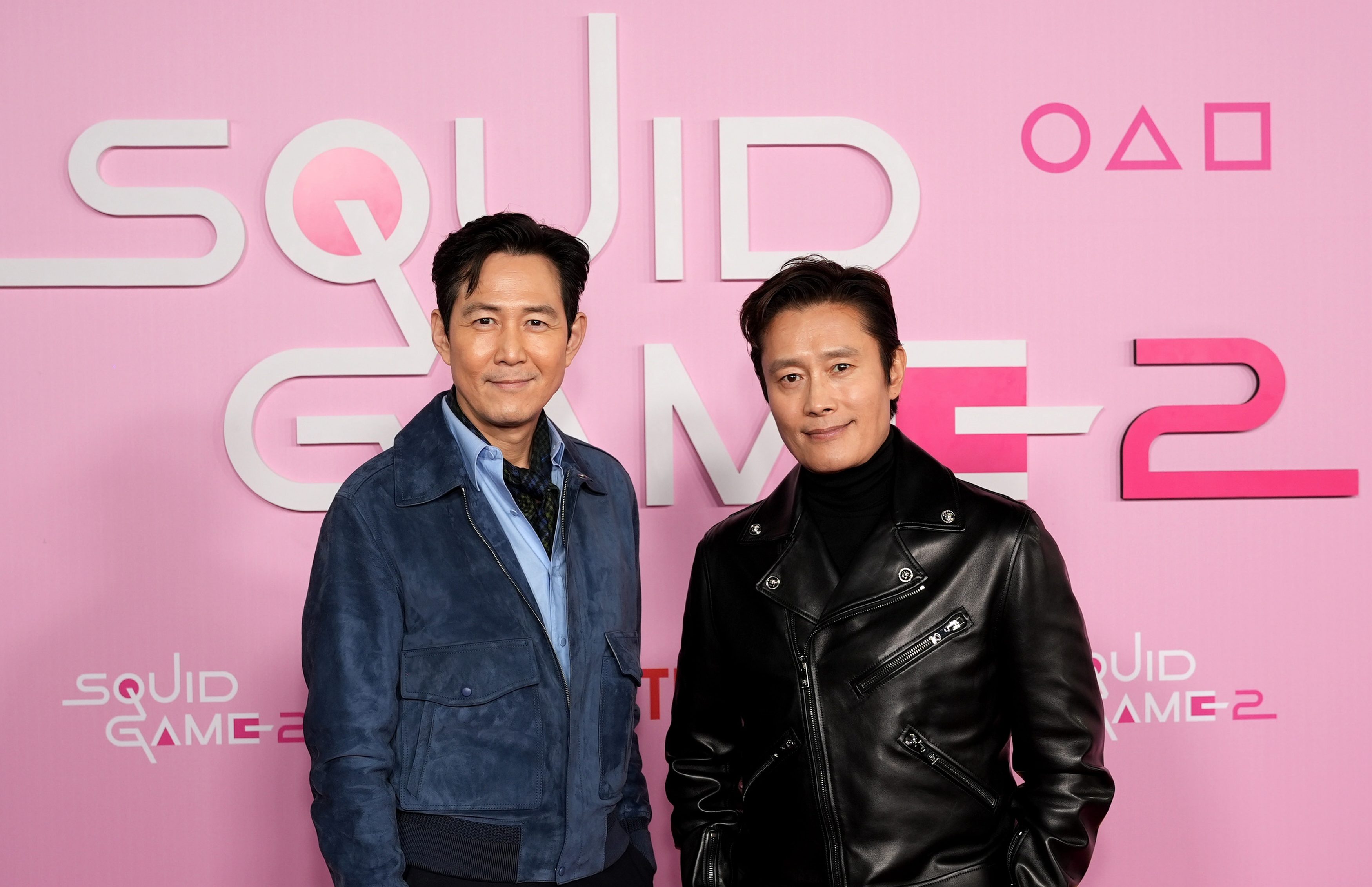 LOS ANGELES, CALIFORNIA - DECEMBER 12: (L-R) Lee Jung-jae and Lee Byung-hun attend the Los Angeles Premiere & Fan Event for Netflix's "Squid Game" Season 2 at Los Angeles City College on December 12, 2024 in Los Angeles, California.  (Photo by Presley Ann/Getty Images for Netflix)