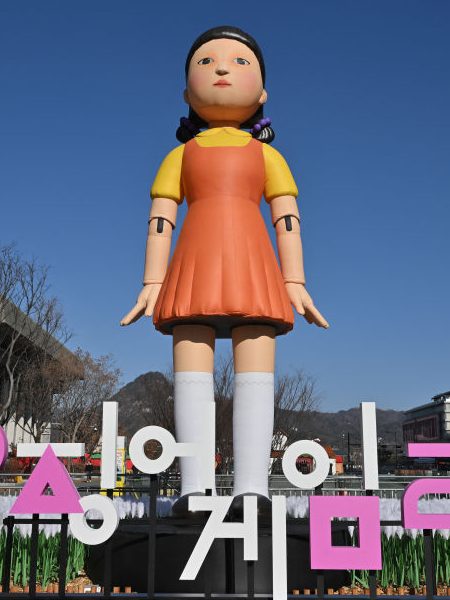 An inflatable Young-hee doll is displayed to promote Netflix's South Korean series "Squid Game Season 2" at Gwanghwamun Square in Seoul on December 26, 2026. (Photo by Jung Yeon-je / AFP) (Photo by JUNG YEON-JE/AFP via Getty Images)
