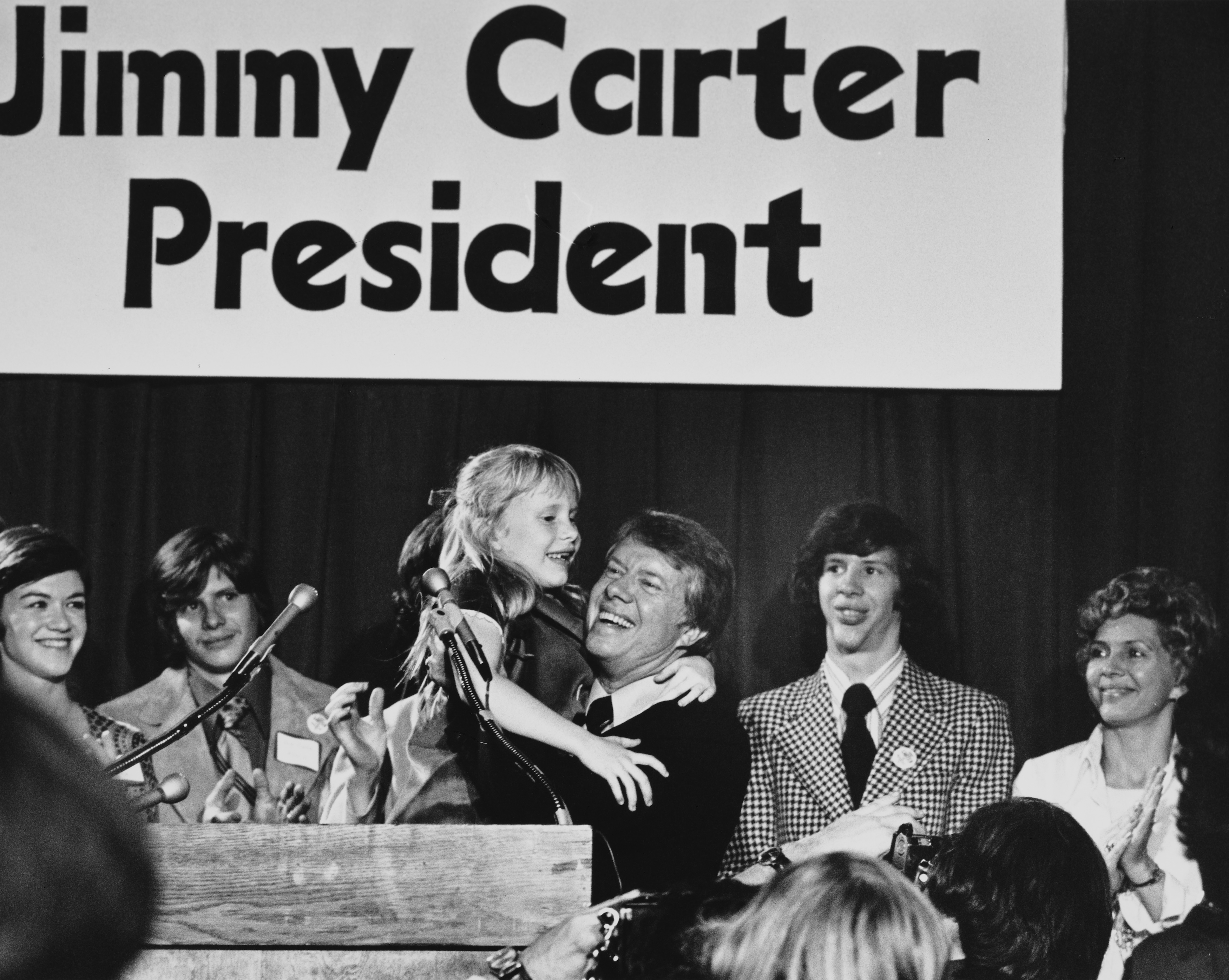 Jimmy Carter, Governor of Georgia, holds up his daughter Amy as he announced that he is to seek the Democratic presidential nomination, Atlanta, Georgia, December 12th 1974. Other family members are on the podium behind him. (Photo by UPI/Bettmann Archive/Getty Images)