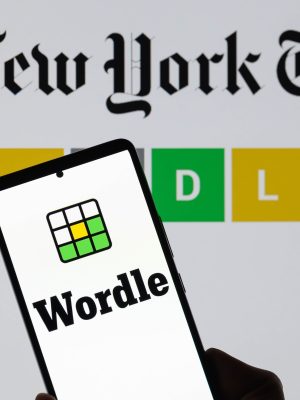 The Wordle logo is being displayed on a smartphone with The New York Times visible in the background in this photo illustration in Brussels, Belgium, on June 1, 2024. (Photo by Jonathan Raa/NurPhoto)