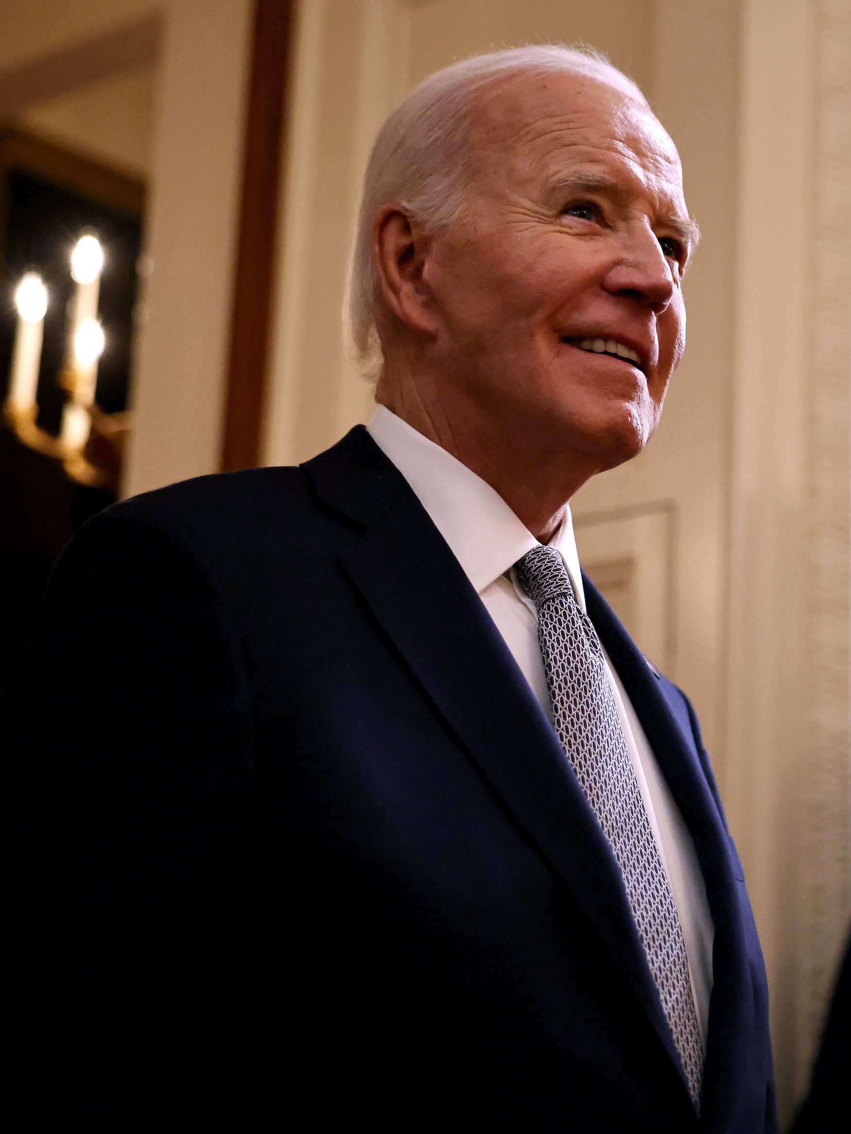 WASHINGTON, DC - JANUARY 02: U.S. President Joe Biden walks into the East Room to host the Presidential Citizens Medal ceremony at the White House on January 02, 2025 in Washington, DC. Biden gave the medal to 20 people who worked on causes supported by the president during his decades of public service, including desegregation, women's rights, gun safety, LGBTQ+ rights, cancer research and military affairs. (Photo by Chip Somodevilla/Getty Images)