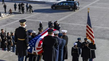 WASHINGTON, DC - JANUARY 9: The flag-draped casket of former U.S. President Jimmy Carter is carried by a joint services body bearer team down the steps of the U.S. Capitol on January 9, 2025 in Washington, U.S. There will be a state funeral for Carter at Washington National Cathedral today. (Photo by Shawn Thew-Pool/Getty Images)